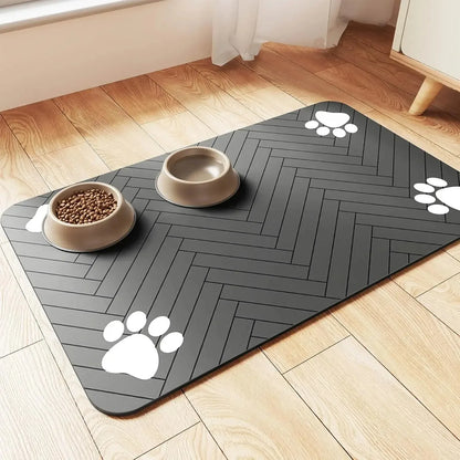 Absorbent pet feeding mat with food and water bowls on a wooden floor