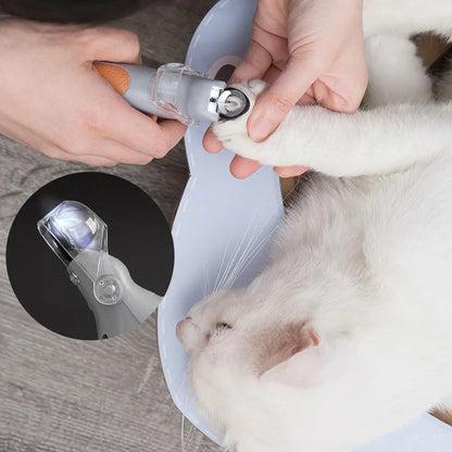 Trimming a white cat's nail with the LED pet nail clipper