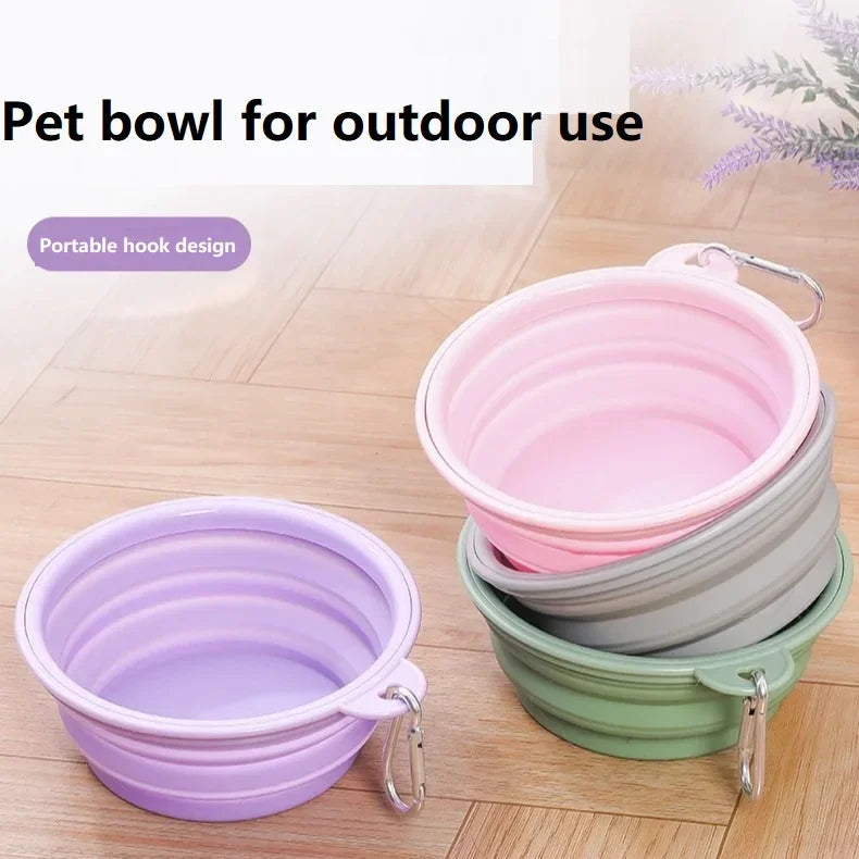 Purple, pink, grey and green collapsible bowls with carabiner clips