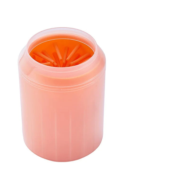 Orange dog paw cleaner cup with soft silicone bristles inside