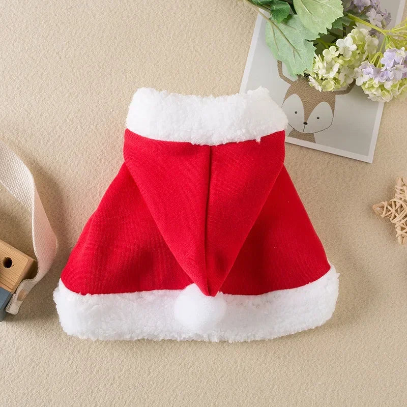 Pet wearing a Santa or reindeer hooded Christmas cape with Velcro neck closure