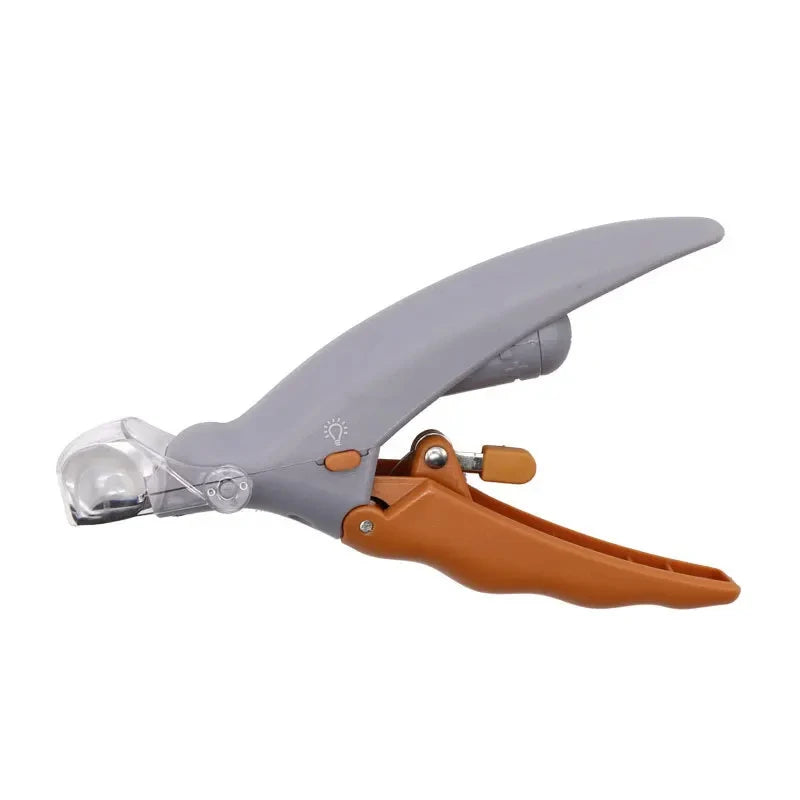 LED pet nail clipper with grey handle, orange grip and clear magnifying cover