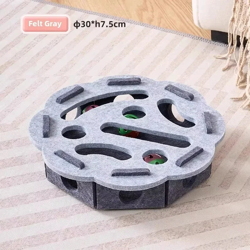Round grey felt cat puzzle box with paw holes