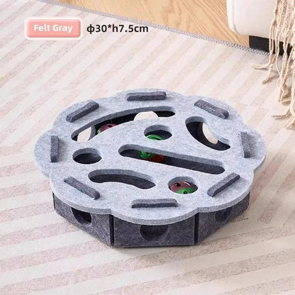 Round grey felt cat puzzle box with paw holes