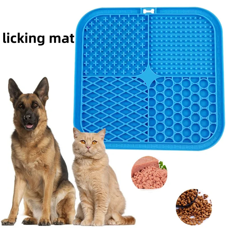Dog and cat sitting next to a blue silicone lick mat