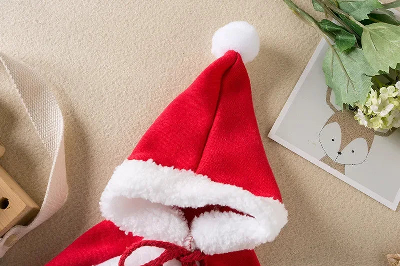 Pet wearing a Santa or reindeer hooded Christmas cape with Velcro neck closure