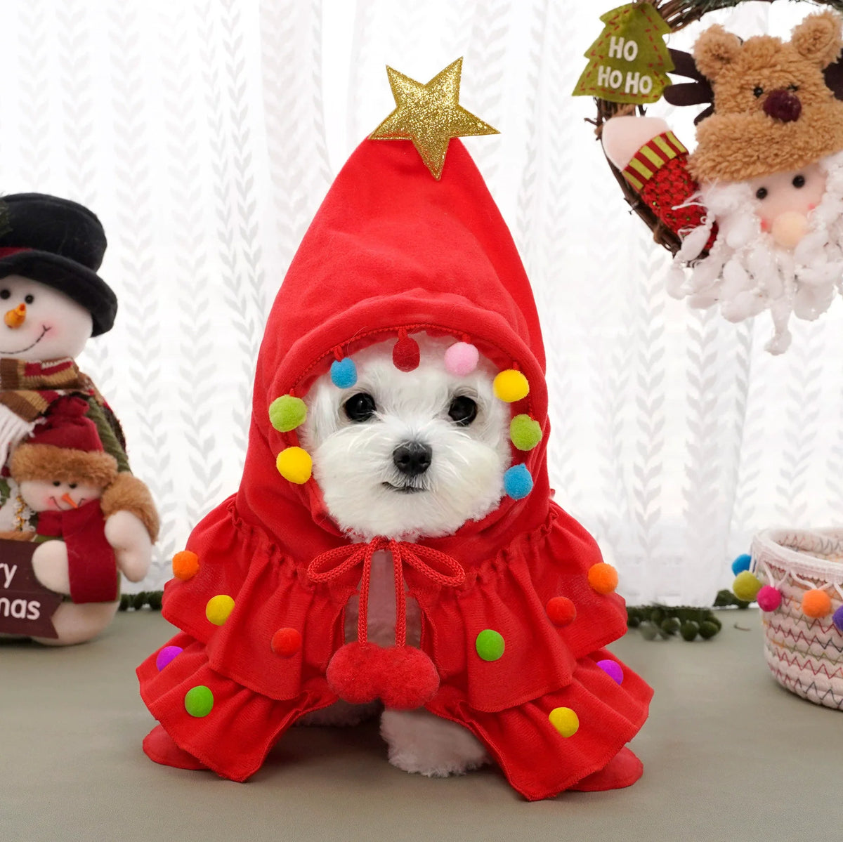 Pet wearing the red Christmas tree cape for cats and small dogs